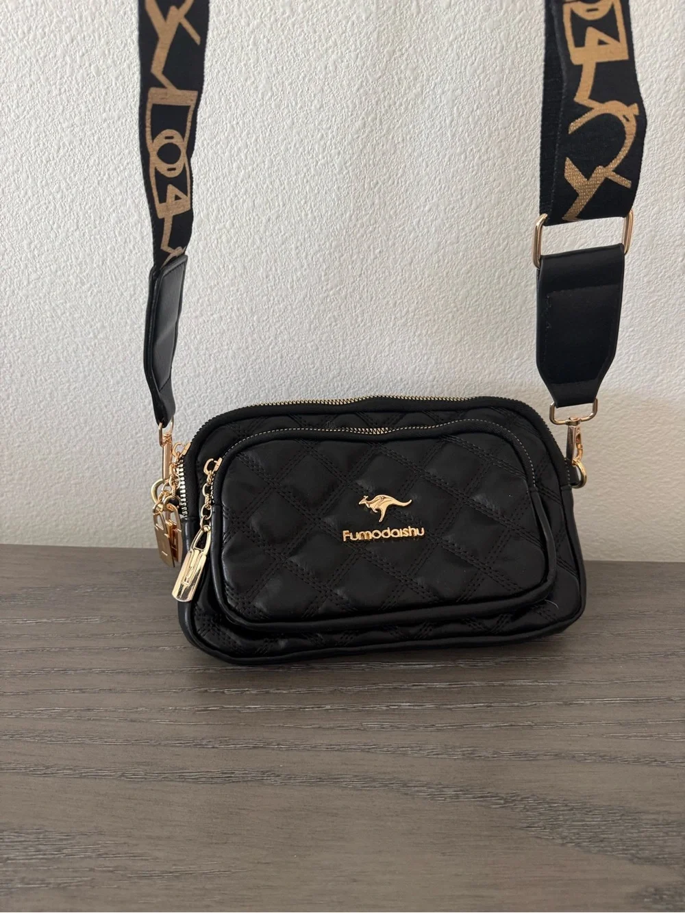 Quilted Black Crossbody Bag with Logo Strap